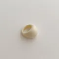 Macro detail of minimalist cream resin ring featuring a smooth polished glossy finish - Chunky Ring / Off White
