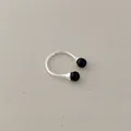 Close-up of a minimalist silver open ring featuring two polished black onyx beads - Black Agate Ring