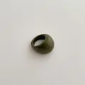 Close-up of olive green thick resin ring with polished finish and vintage style - Chunky Ring / Dark Green