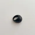 Chunky minimalist black resin ring with a glossy finish on a textured white background - Chunky Ring / Black