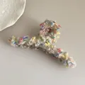 Close-up of plush macaron dot hair claw clip with colorful fabric and gold thread - Beige Mixed Straight