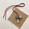 Handmade fabric mushroom pendant with floral print and red cord on rustic linen base - Flower Mushroom (T37)