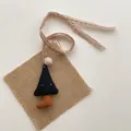 Detail of a handmade navy blue polka dot plush pendant with lace cord and pom-pom - Black Umbrella (T58)