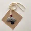 Detail of gray polka dot umbrella pendant with a red pompom and lace ribbon strap - Gray Umbrella (T41)