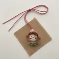 Detail of a handmade plush strawberry girl doll pendant with a pink suede bow lanyard - Red Cheek Girl (T70)