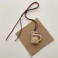 Detail of handcrafted burlap coffee cup pendant with embroidery and rustic cord - Straight Coffee Cup (T65)