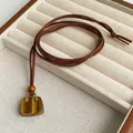 Natural tiger eye stone handbag pendant necklace on brown suede cord for women - Tiger's Eye Style