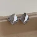 Detail of silver geometric stud earrings with spiral tassel fringe on craft card - Silver (E13)