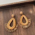 Detail of handmade woven raffia earrings with teardrop frame and bohemian fan fringe - Teardrop Half Circle Tassel Wood Color (A302)