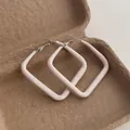 Detail of square geometric hoop earrings with cream enamel finish and stud closure - Large Square / Off White