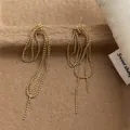Detail of gold beaded tassel earrings with layered chain drop on vintage background - Knot Ball Chain Tassel Style / Gold (T-81)