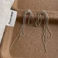 Detail of silver beaded tassel earrings showing fine chain texture and metallic luster - Knot Ball Chain Tassel Style / Silver (T-81)