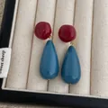 Detail of retro acrylic drop earrings with red round beads and cyan teardrop pendants - Blue And Red (L-18)