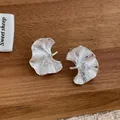Detail of silver ginkgo leaf stud earrings with triangular zircon on dark wood background - Gingko Leaf Shape (Silver)