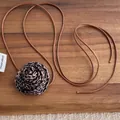 Leopard print rose flower long rope necklace choker on dark wood background - Leopard Rose