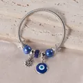 Close-up of silver beaded bracelet with blue Evil Eye, starfish, and daisy charms - Silver Dark Blue Evil Eye Starfish Style (7)