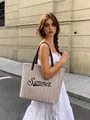 Large striped beach tote bag with Summer lettering and black leather handles shown outdoors - 45*37*13cm / Pink Mint Green and White Stripes Summer Print (Style 2)