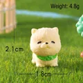 Miniature resin puppy figurine with green bib, size 2.1cm, ideal for DIY decor - Chow Chow