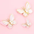 Elegant 3D butterfly cake toppers with gold foil edges and pearls on pink background - Pearl Pink Butterfly