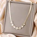Golden titanium steel snake chain necklace with seven white star pendants for women - Shell Star Style (N-39)