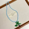 Handgemaakte lichtblauwe kralenketting met een kokospalm hanger voor de zomer vakantie - Type D-Blauwe Kralen Schelp Bloem