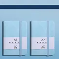 Light blue A7 mini pocket notebook with hardcover, elastic band and ruled inner pages - A7 / Light Blue