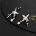 Close-up of star stud earrings with pavé crystals and hanging white round pearl drops - Silver Star and Artificial Pearl Dangle Style(E)