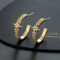 Detail view of gold C-shaped earrings with clear zircon stones and star motif - Golden Star Sawtooth Edge C-shaped Hoop Style(F)