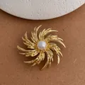 Detail of golden radial fireworks brooch with a central pearl on retro suit accessories - Gold (B-06)