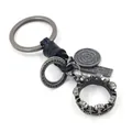 Retro punk keychain with black braided leather, silver crown charm and metal pendants - Crown