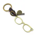 Retro glasses-shaped leather keychain featuring bronze alloy charms and vintage accents - Glasses