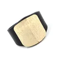 Wide black litchi leather cuff bracelet featuring a textured gold metal plate for women - Black