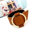 Wide brown leather bracelet featuring a large golden metal ring in a retro minimalist style - Light Coffee
