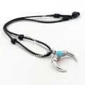 Ethnic alloy horn pendant necklace with turquoise inlay and braided black cord - Horn Crescent Style