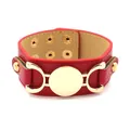 Red PU leather wide cuff bracelet featuring gold buckle detail and adjustable studs - Red
