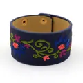 Navy blue faux leather wide cuff bracelet with colorful floral embroidery and gold snaps - Blue