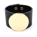 Wide black litchi leather cuff bracelet with a large polished gold round metal plate - Black