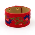 Red PU leather wide cuff bracelet featuring vibrant floral embroidery and gold snap buttons - Red
