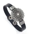 Retro black leather bracelet featuring a vintage hollow circular metal flower pattern charm - Black
