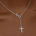 18K gold plated infinity cross necklace with CZ stones worn on neck for a minimalist look - Silver Zirconia Cross
