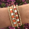 Set of 5 bohemian 18K gold-plated beaded bracelets with colorful Tila beads on a wrist - Bohemian Color Block Style (BR8031)