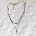 Macro detail of a double-layered stainless steel necklace featuring a cross pendant and clasp - Single Paperclip Chain (NK8076) / Steel