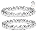 Macro view of two 8mm silver stainless steel beaded bracelets with mirror polish - Silver Thick Round Bead Style (BR8030)