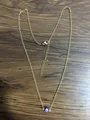 Detailed shot of golden stainless steel chain with evil eye pendant and lobster clasp - Blue Eye Gold