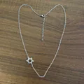 Silver stainless steel chain necklace featuring an asymmetrical Star of David pendant - Steel