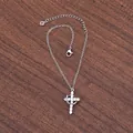Macro shot of silver cross necklace with inlaid 3A zircons on a dark wood background - Single Layer Silver With Pendant