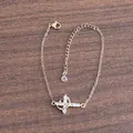 Detailed view of 18K gold double-layer crown cross bracelet with micro-pave zircons - Horizontal Cross Gold Style