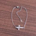 Macro detail of silver cross bracelet with cubic zirconia inlay and adjustable link chain - Horizontal Cross Silver Style