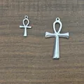 Polished silver Ankh cross pendants in large and small sizes on wooden background - Pendant Only (Without Chain) / Large Steel Color