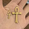 Pair of gold Ankh cross pendants in large and small sizes held in a palm for size - Pendant Only (Without Chain) / Large Gold